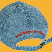 Load image into Gallery viewer, Denim hat with red lettering &quot;Zack&#39;s Mighty Tortilla Chips&quot; on the back.
