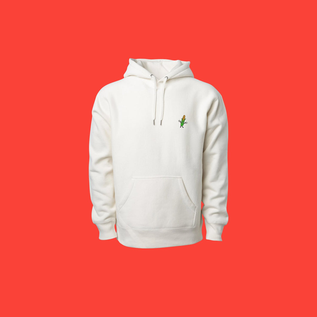 White hoodie with a small illustration of a corn cob lifting weights in the upper right.